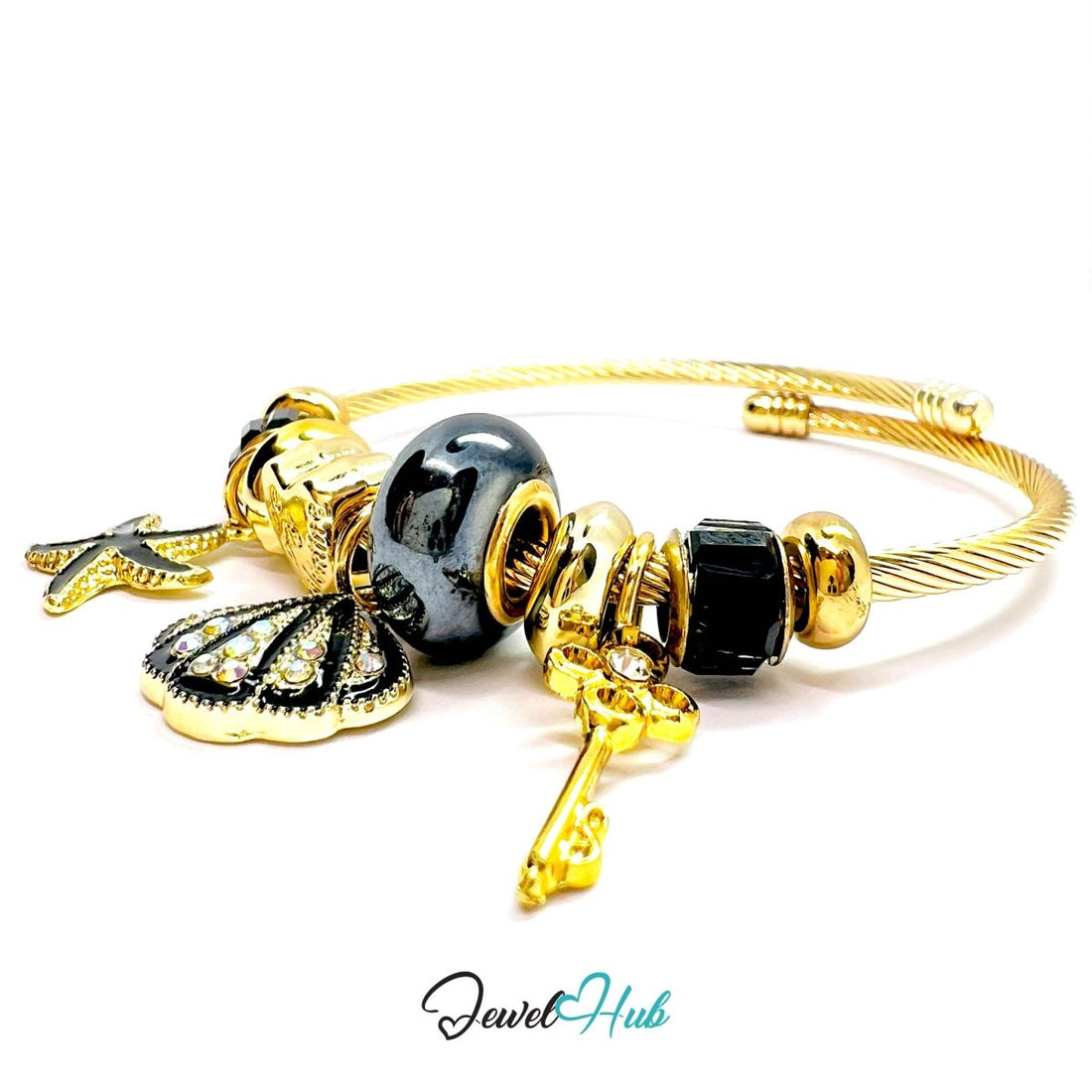 Gold and black charm bracelet on a white background with 'Jewel Hub' branding.
