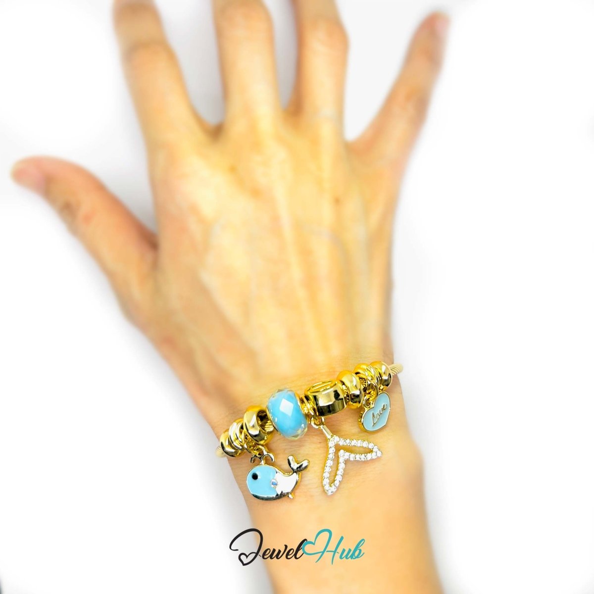 Gold Stainless Steel Cyan Fishtail & Whale Charm Bangle - JewelHub.co.uk