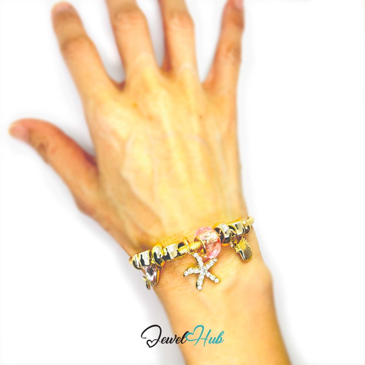 Gold Stainless Steel Pink Gem Starfish Fishbone Charm Bangle - JewelHub.co.uk