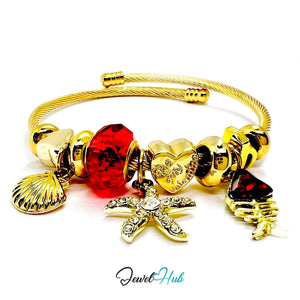 Gold Stainless Steel Red Gem Starfish Fishbone Charm Bangle - JewelHub.co.uk