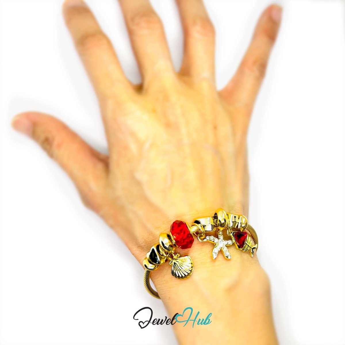 Gold Stainless Steel Red Gem Starfish Fishbone Charm Bangle - JewelHub.co.uk
