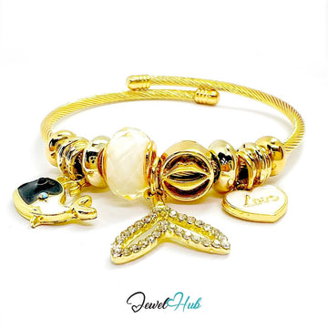 Gold Stainless Steel White Fishtail & Whale Charm Bangle - JewelHub.co.uk