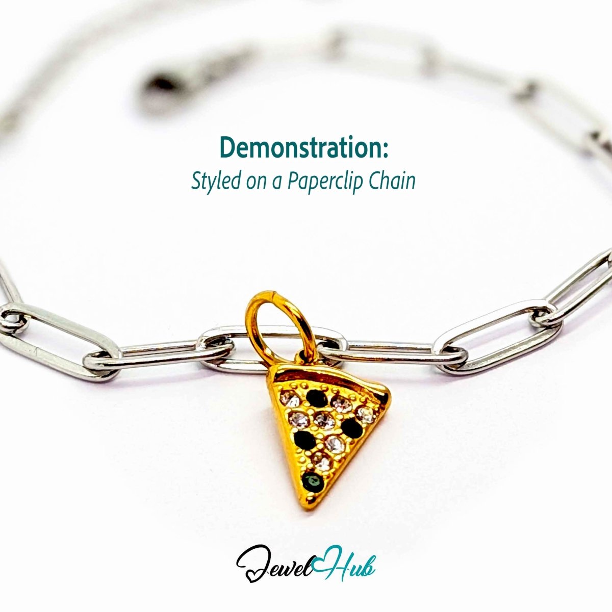 Pizza slice charm in gold stainless steel set with clear and dark green crystals - styled on a silver paperclip chain bracelet - JewelHub