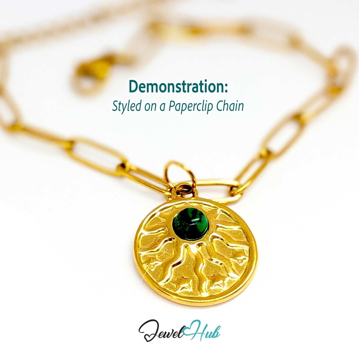 Sun and stars charm in gold stainless steel with a green stone - styled on a gold paperclip chain bracelet - JewelHub