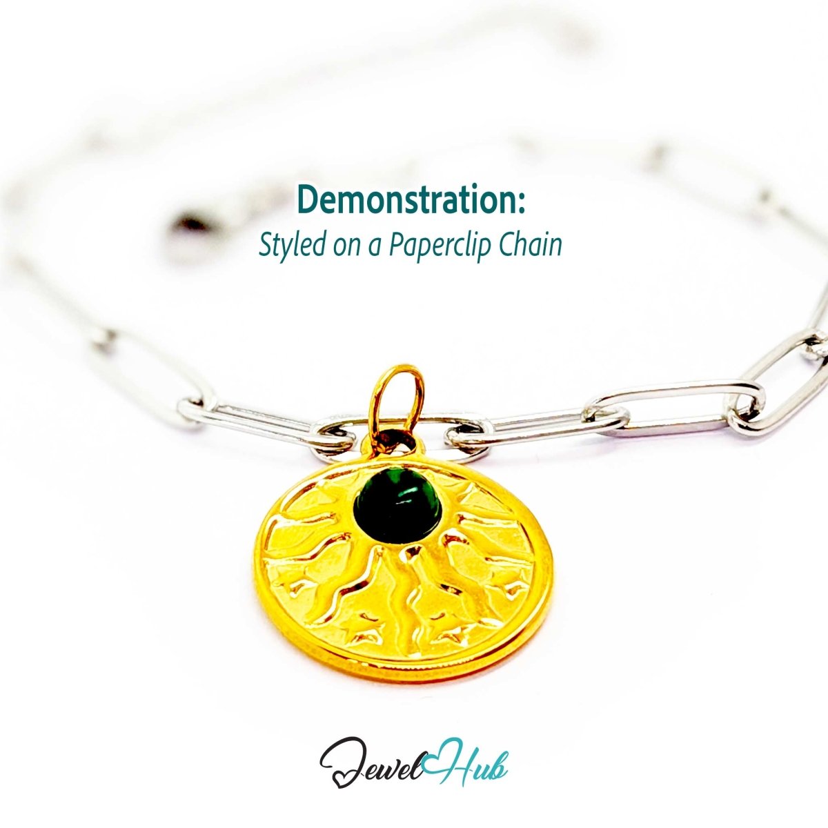 Sun and stars charm in gold stainless steel with a green stone - styled on a silver paperclip chain bracelet - JewelHub