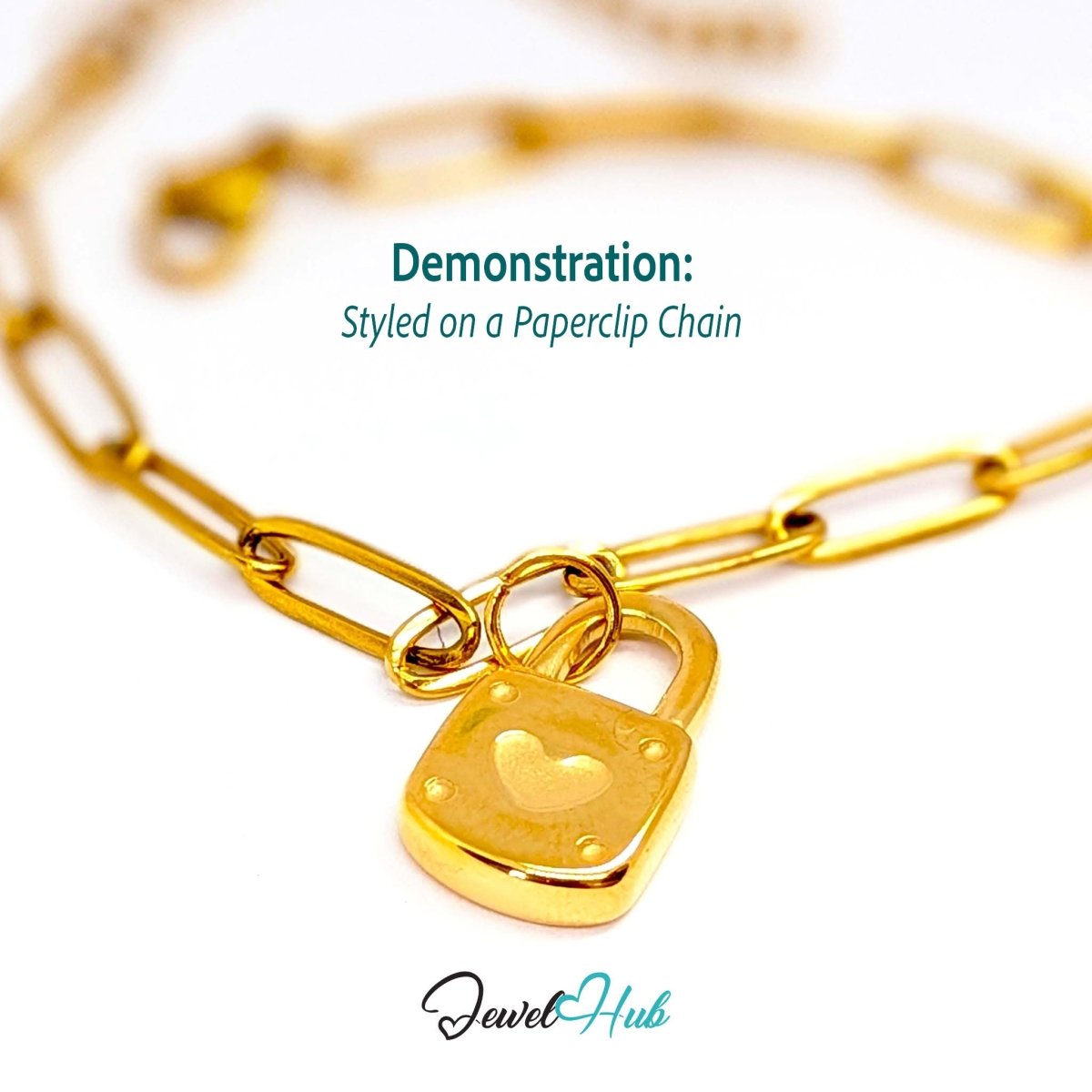 Heart padlock charm in gold stainless steel - styled on a gold paperclip chain bracelet - JewelHub
