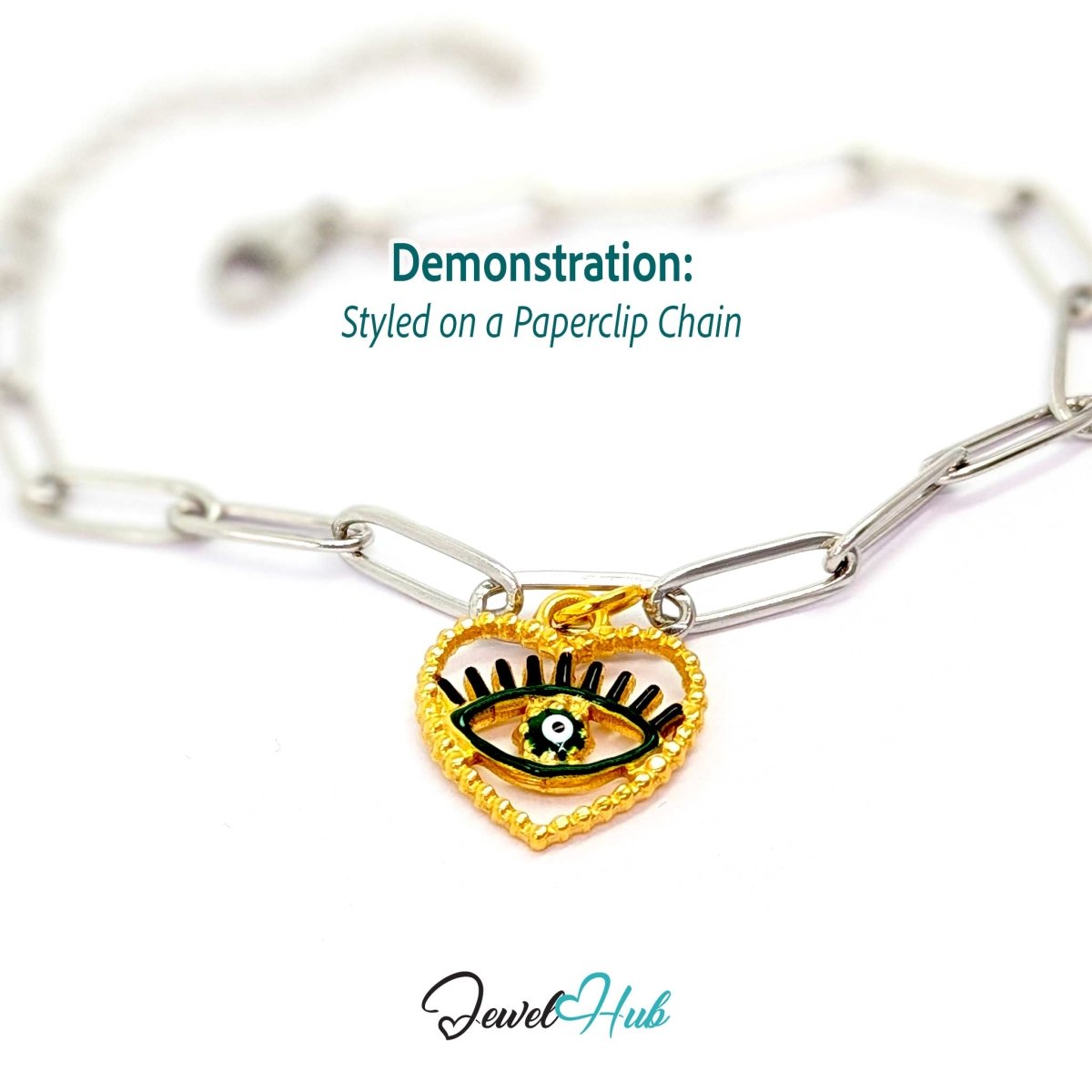 Green Hollow Evil Eye charm, gold stainless steel with enamel, styled on a silver paperclip chain bracelet - JewelHub