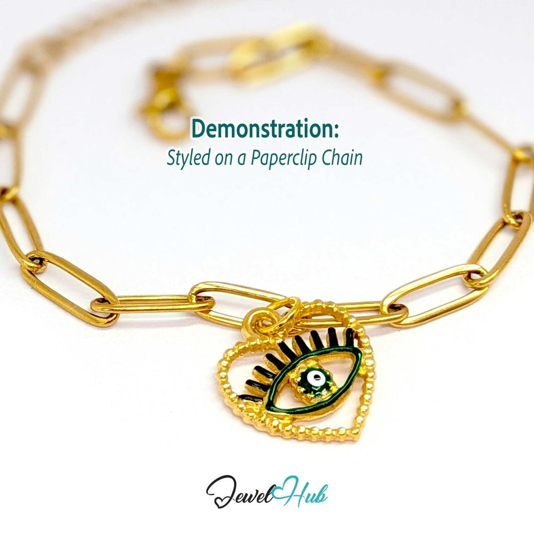 Green Hollow Evil Eye charm, gold stainless steel with enamel, styled on a gold paperclip chain bracelet - JewelHub