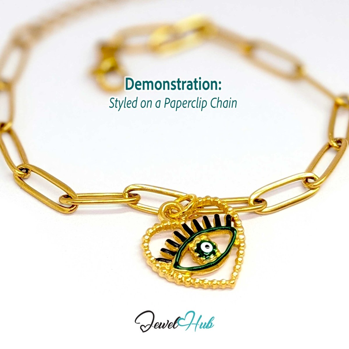 Green Hollow Evil Eye charm, gold stainless steel with enamel, styled on a gold paperclip chain bracelet - JewelHub