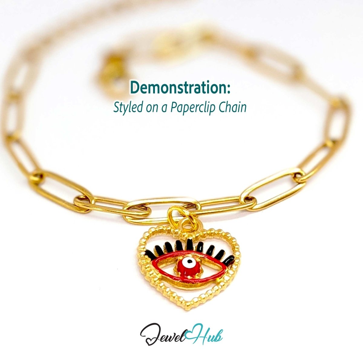 Red Hollow Evil Eye charm, gold stainless steel with enamel, styled on a gold paperclip chain bracelet - JewelHub