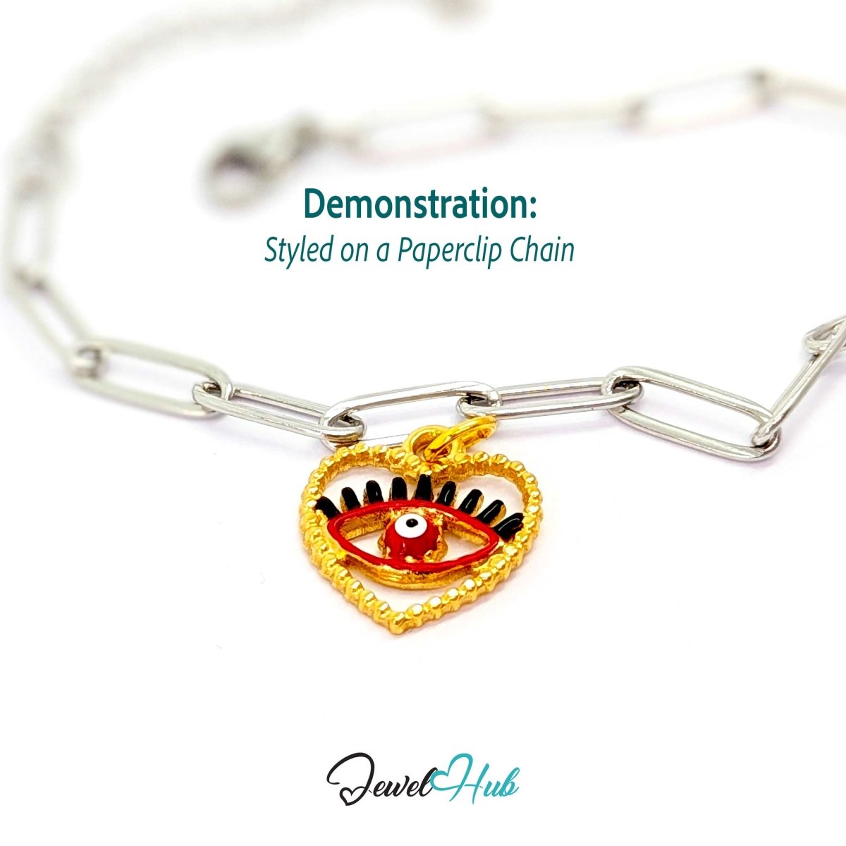 Red Hollow Evil Eye charm, gold stainless steel with enamel, styled on a silver paperclip chain bracelet - JewelHub