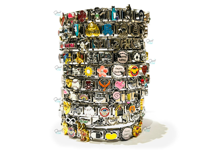 Stack of colorful charm bracelets on a white background