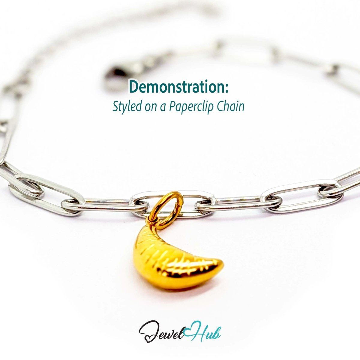 Mini croissant charm in gold stainless steel - styled on a silver paperclip chain bracelet - JewelHub