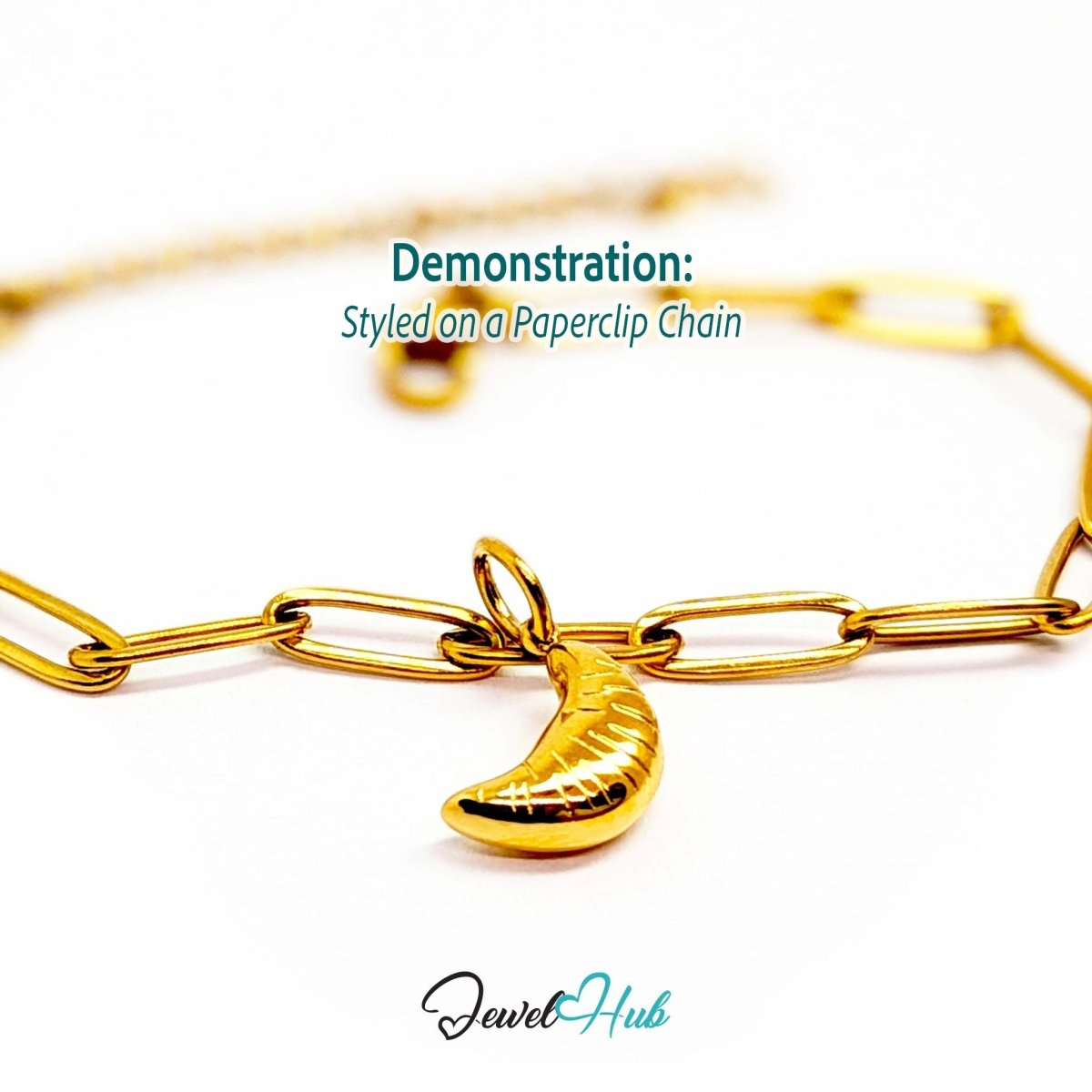 Mini croissant charm in gold stainless steel - styled on a gold paperclip chain bracelet - JewelHub