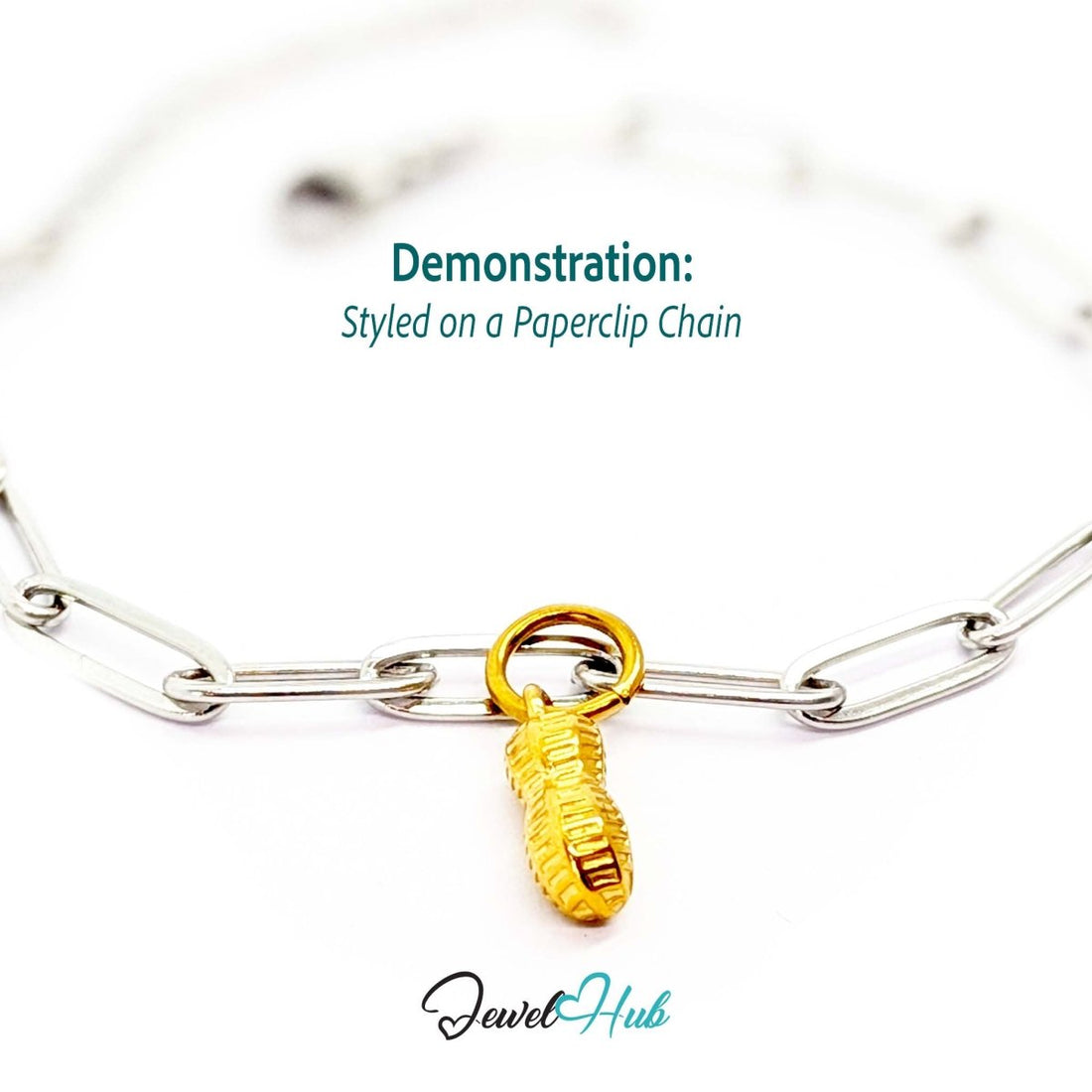 Mini peanut charm in gold stainless steel - styled on a silver paperclip chain bracelet - JewelHub