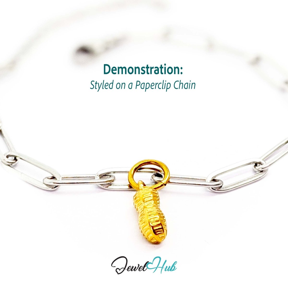 Mini peanut charm in gold stainless steel - styled on a silver paperclip chain bracelet - JewelHub