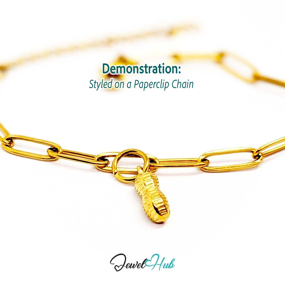 Mini peanut charm in gold stainless steel - styled on a gold paperclip chain bracelet - JewelHub