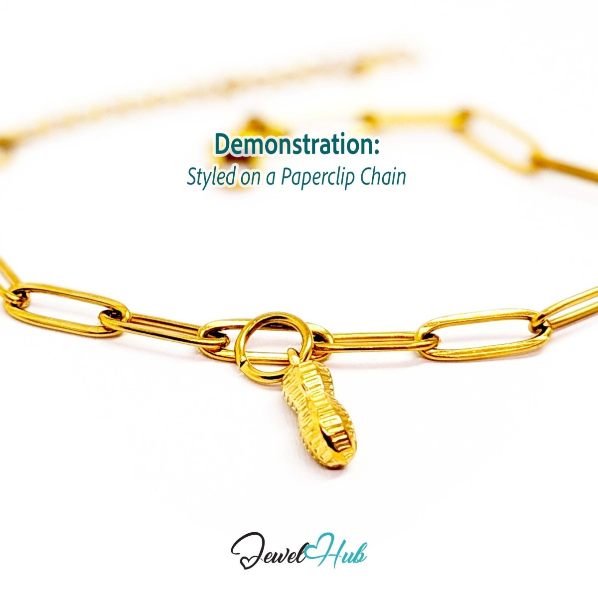 Mini peanut charm in gold stainless steel - styled on a gold paperclip chain bracelet - JewelHub