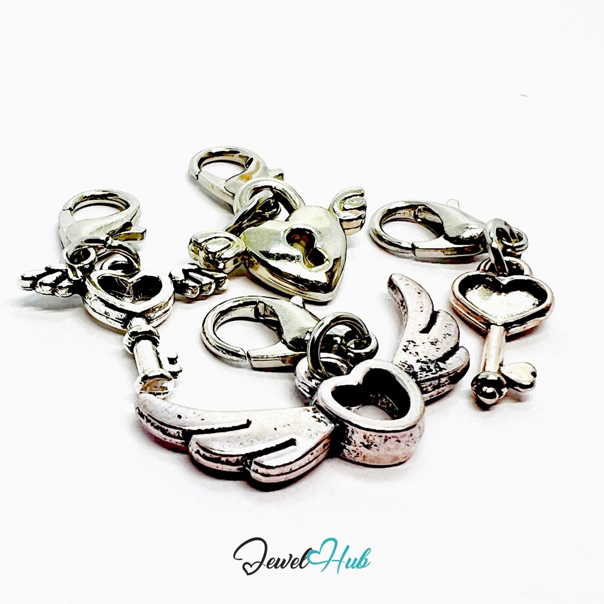 MiniCharm™ Heart & Wing Series – Guarded Flight Pack (Set of 4) - JewelHub.co.uk