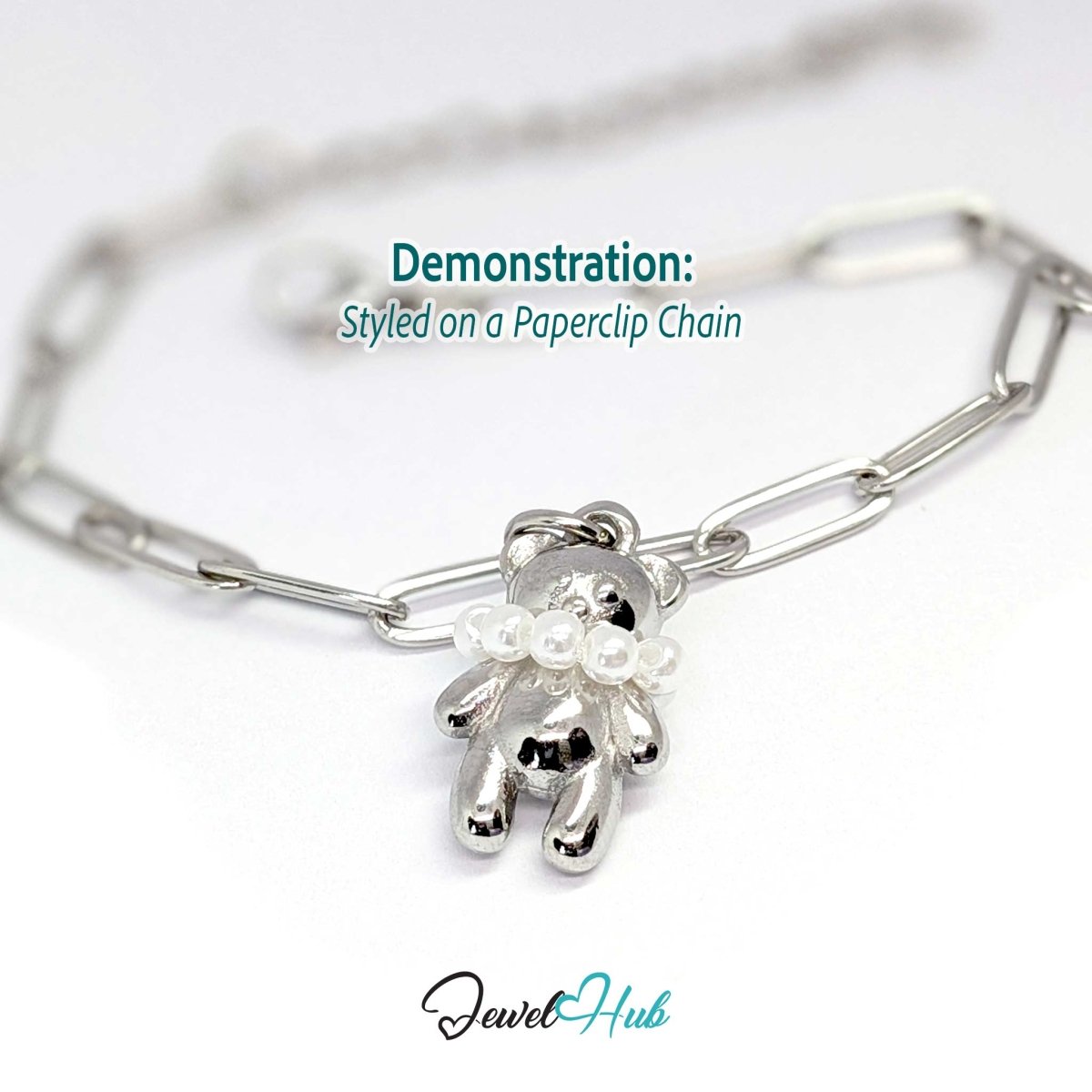 Silver pearl Collar Bear charm styled on a silver paperclip chain bracelet - JewelHub