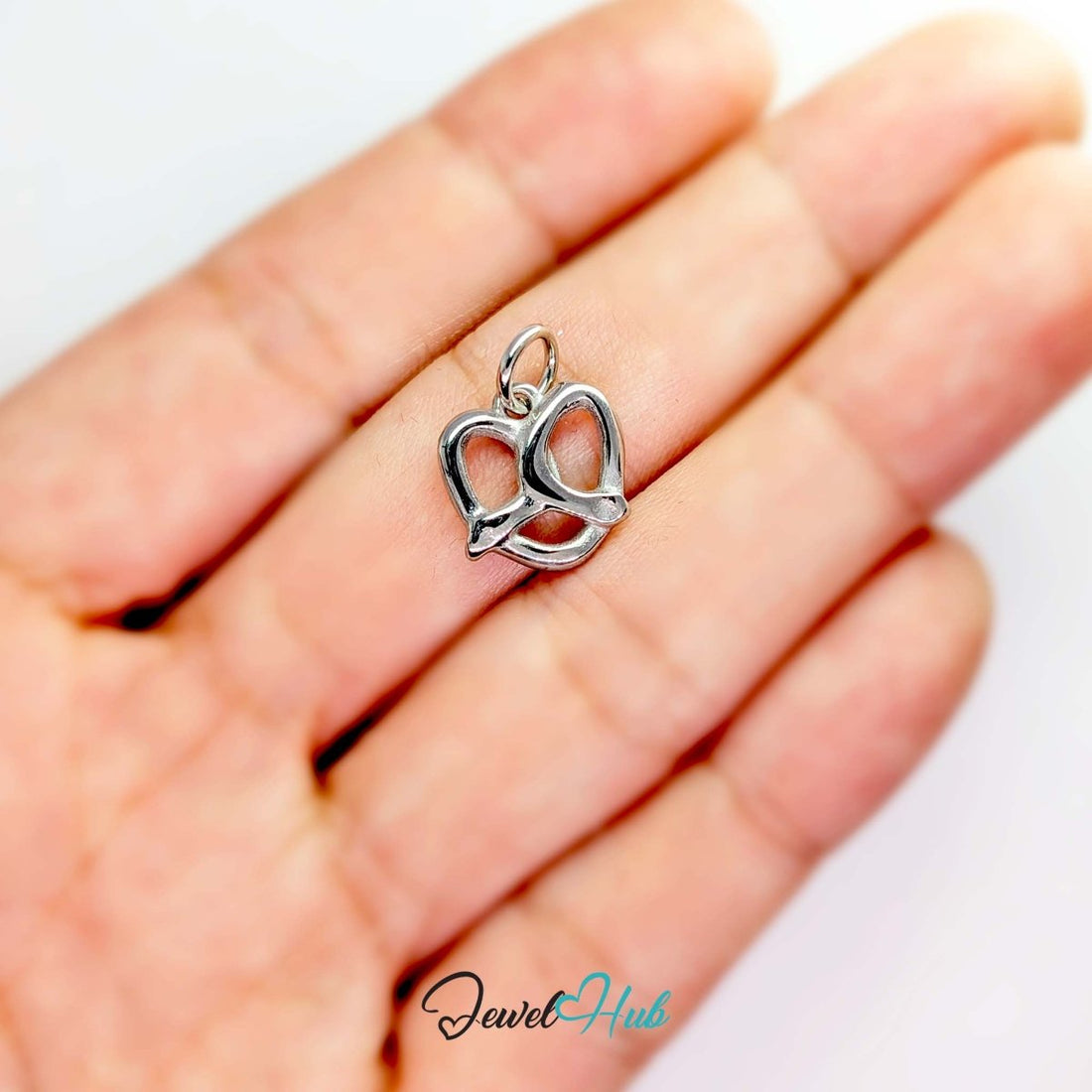 Openwork pretzel charm in silver stainless steel - front view - JewelHub