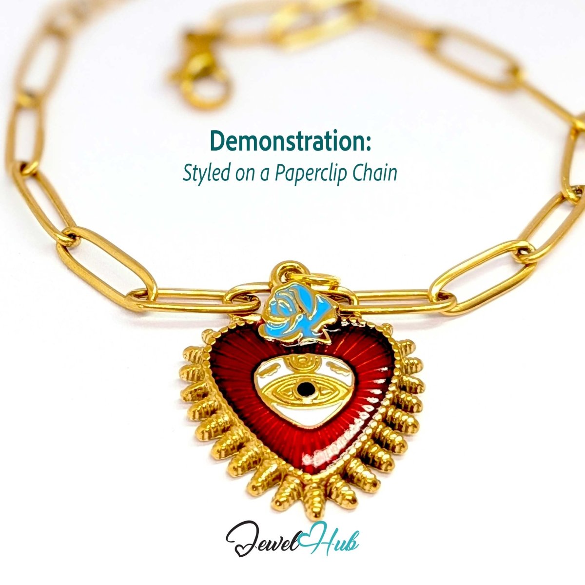 Sacred Heart Evil Eye charm, gold stainless steel, styled on a gold paperclip chain bracelet - JewelHub