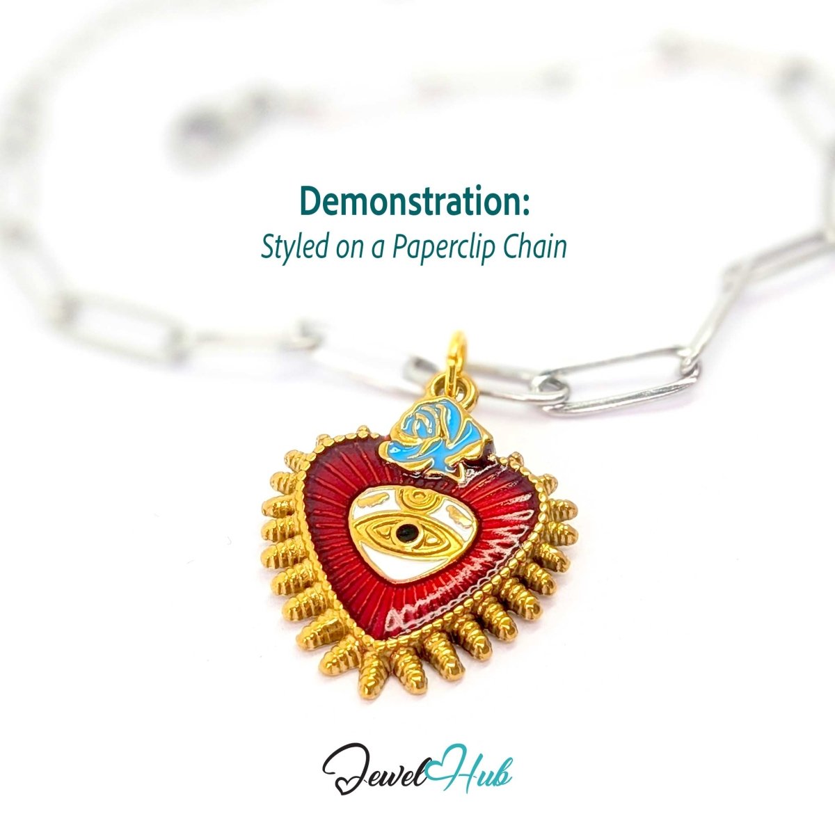 Sacred Heart Evil Eye charm, gold stainless steel, styled on a silver paperclip chain bracelet - JewelHub