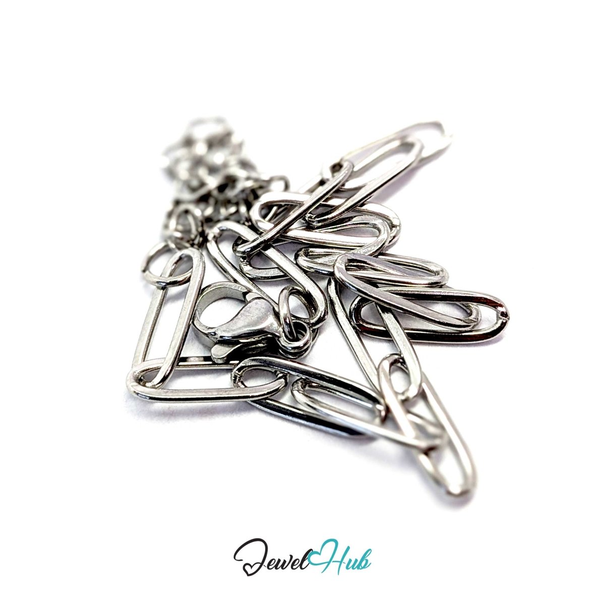 Silver paperclip chain bracelet coiled to show its fine 2.75g weight - JewelHub
