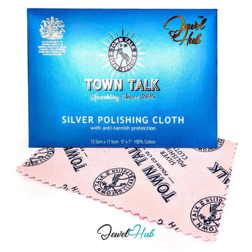 A blue Town Talk polishing cloth box placed above a pink polishing cloth with black printed branding, on a white background. The Jewel Hub logo appears at the top right and bottom center.