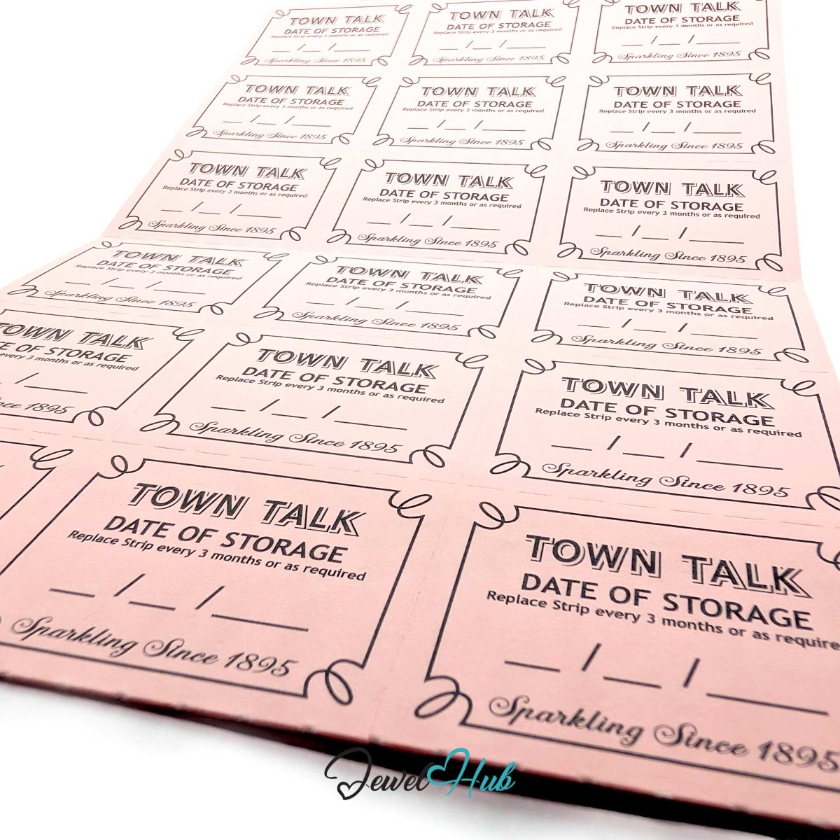 Close-up of pink Town Talk anti-tarnish storage strips printed "Date of Storage — replace strip every 3 months or as required".