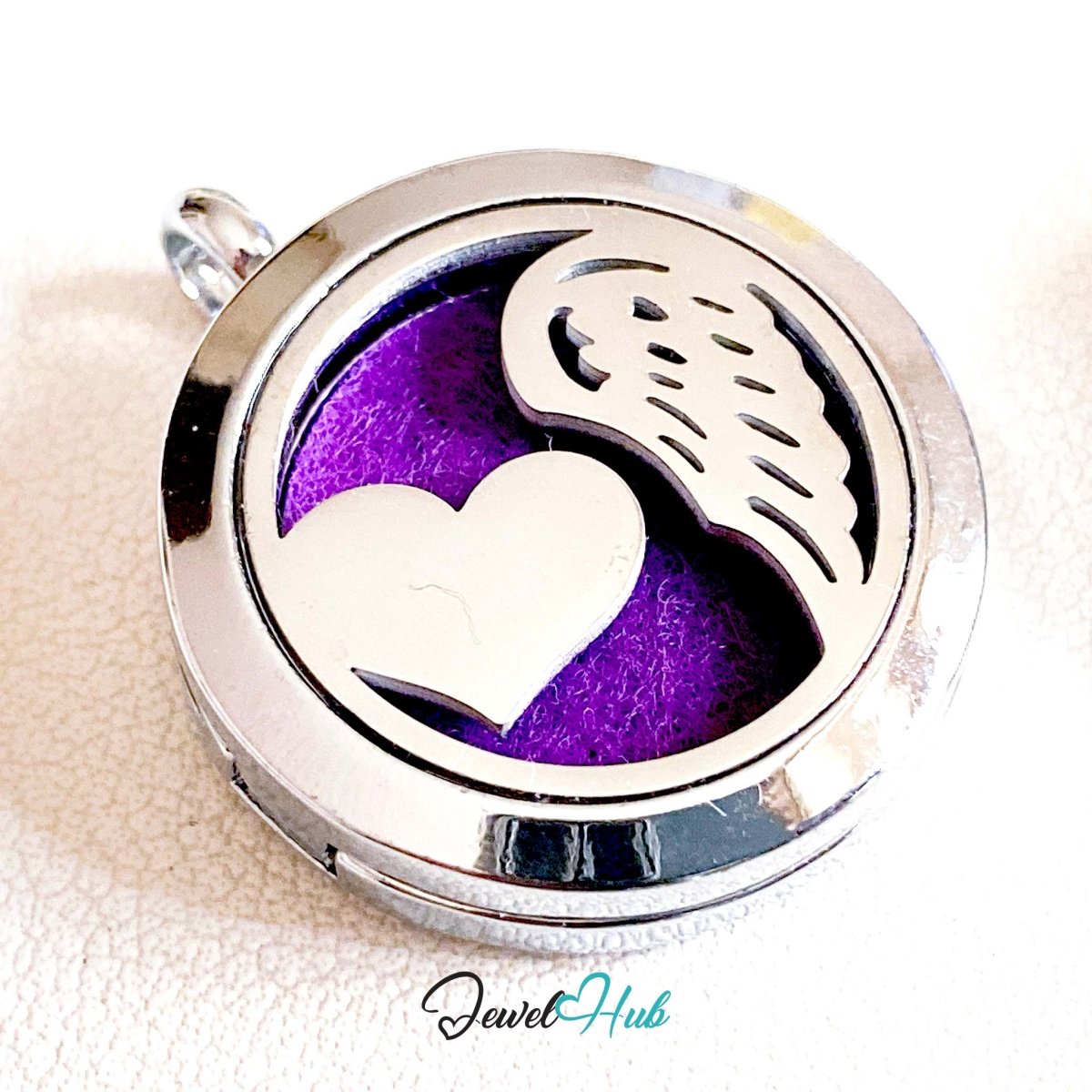 Stainless Steel Aromatherapy Pendant – Heart and Wing - JewelHub.co.uk