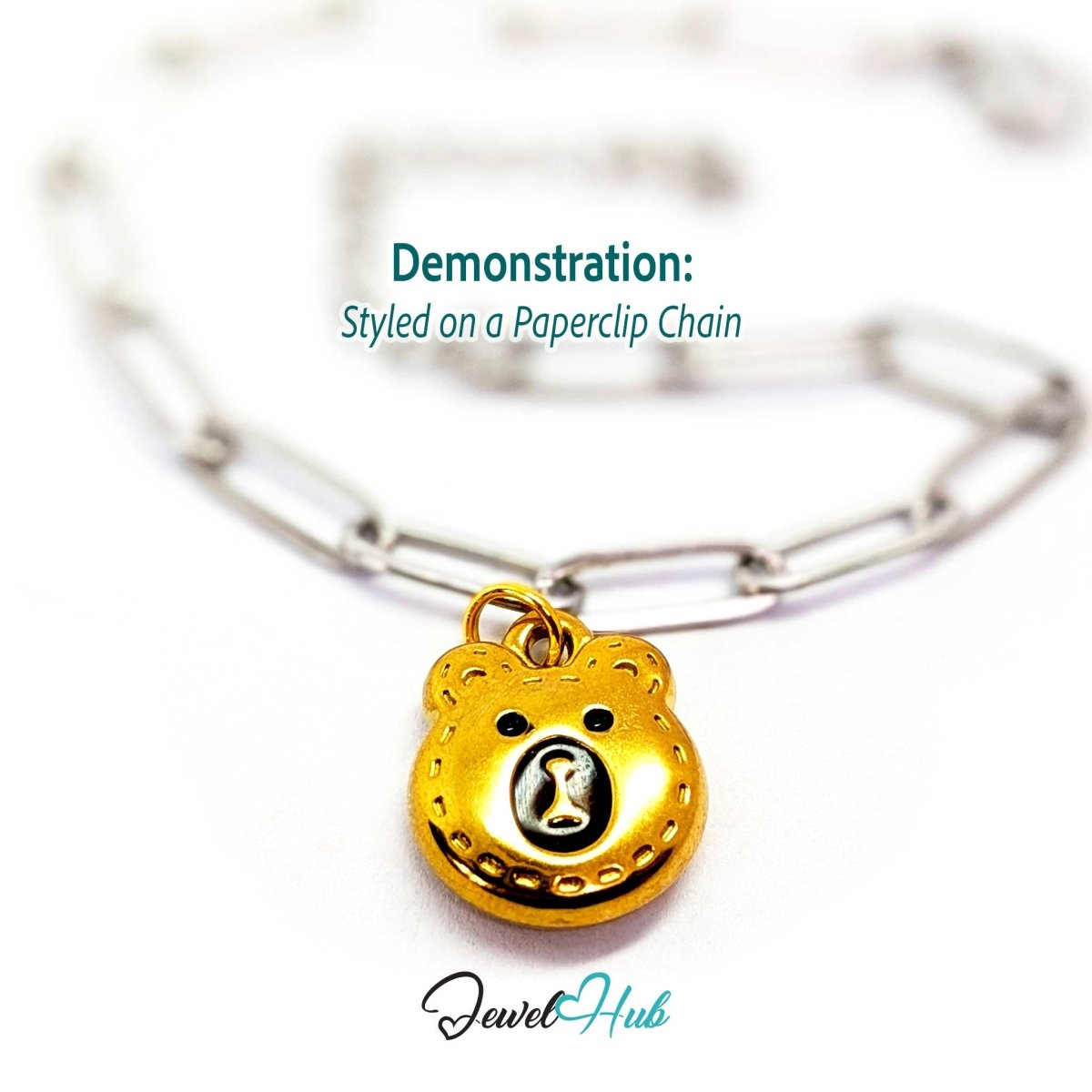 Gold stitched Bear Head charm styled on a silver paperclip chain bracelet for a two-tone look - JewelHub