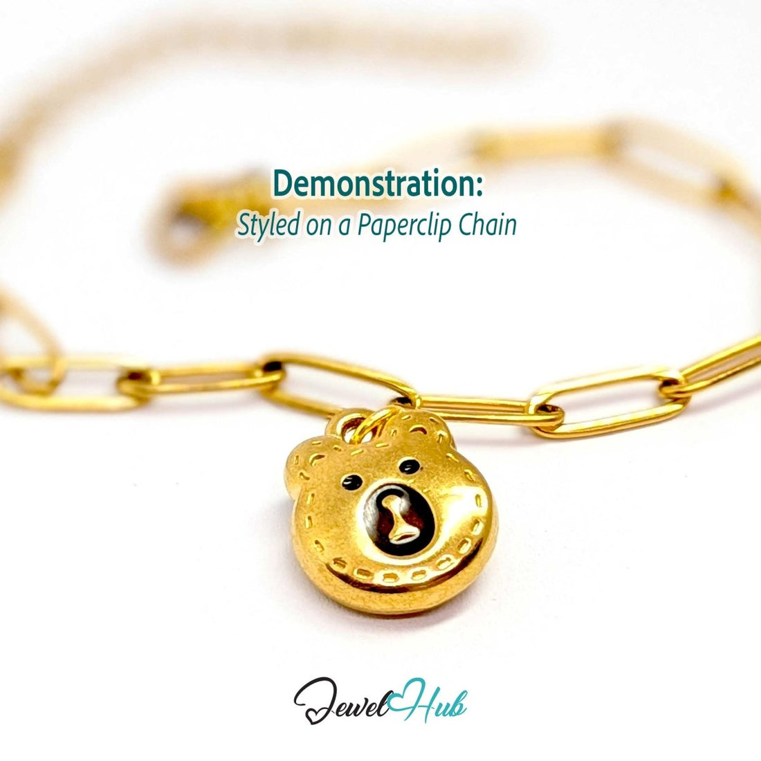 Gold stitched Bear Head charm styled on a gold paperclip chain bracelet - JewelHub
