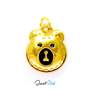 Stitched Bear Head charm in gold-tone stainless steel with black enamel eyes and engraved stitch lines - JewelHub
