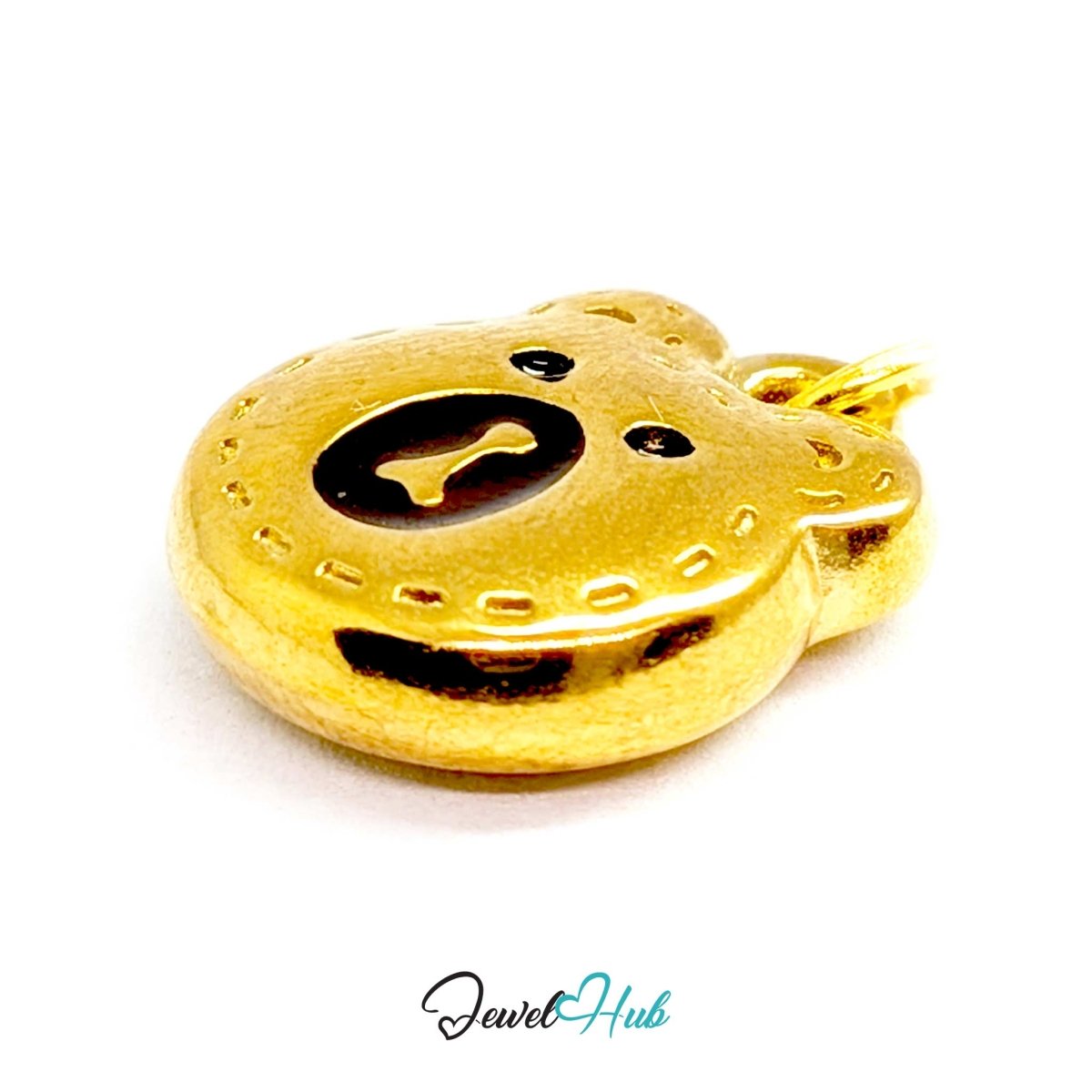Gold Stitched Bear Head charm seen from the side, showing the jump ring at the top - JewelHub