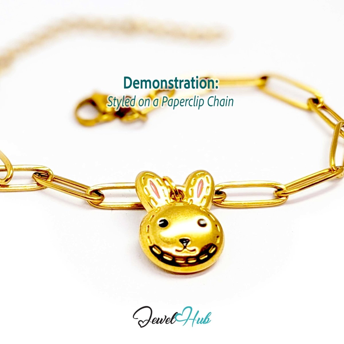 Gold stitched Bunny Head charm styled on a gold paperclip chain bracelet - JewelHub