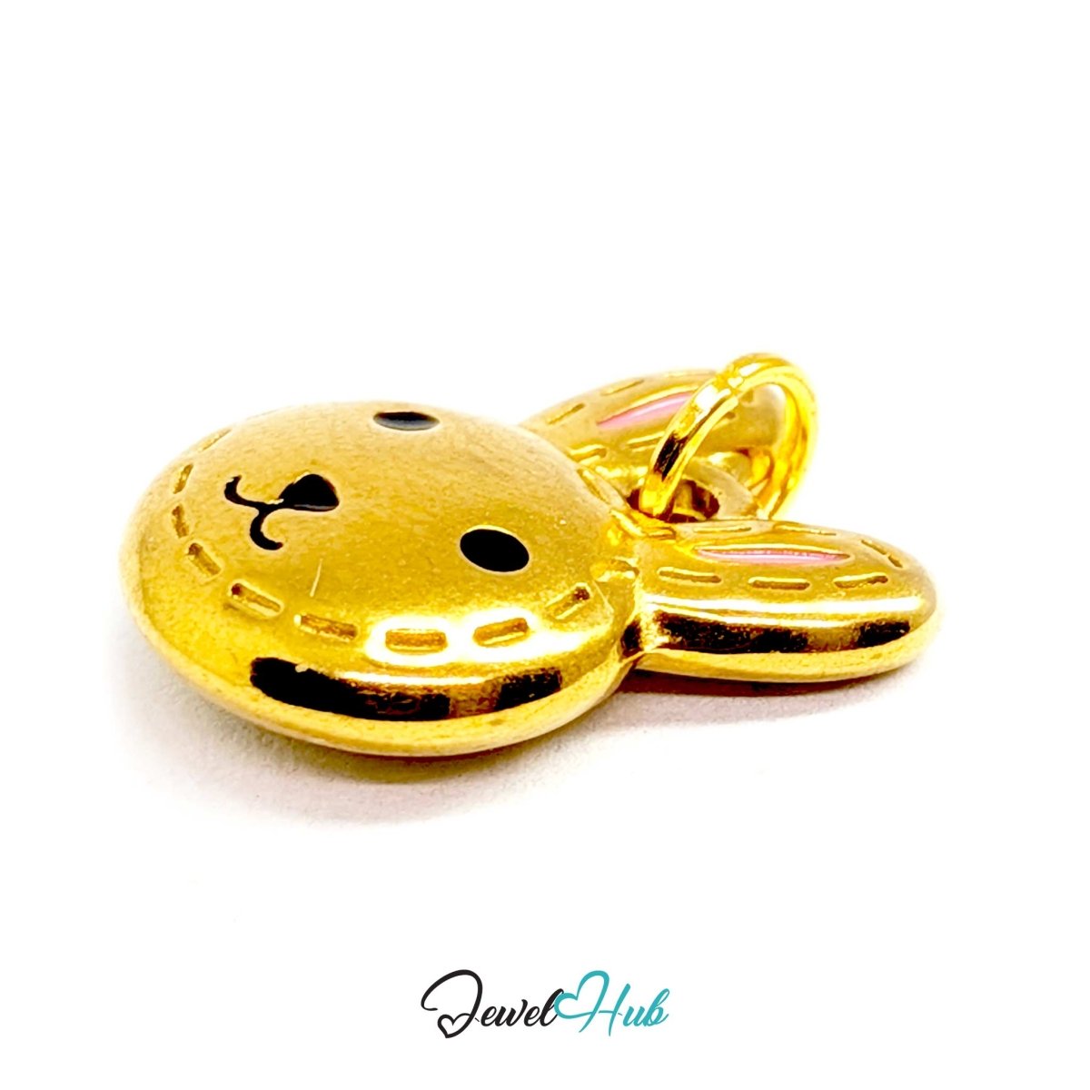 Angled view of the gold Stitched Bunny Head charm showing its long upright ears - JewelHub