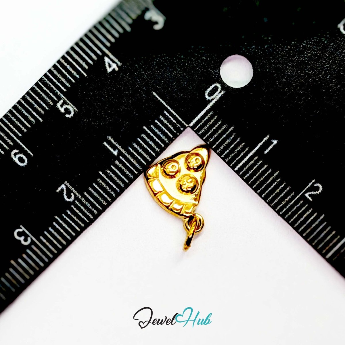 Three topping pizza slice charm in gold stainless steel - beside a ruler for scale - JewelHub