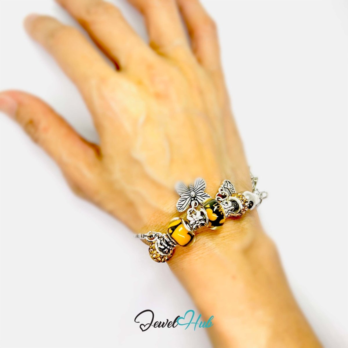 Zinc Alloy Amber Duo Bead Butterfly Rose Crown Charm Bracelet 18 - 22cm - JewelHub.co.uk