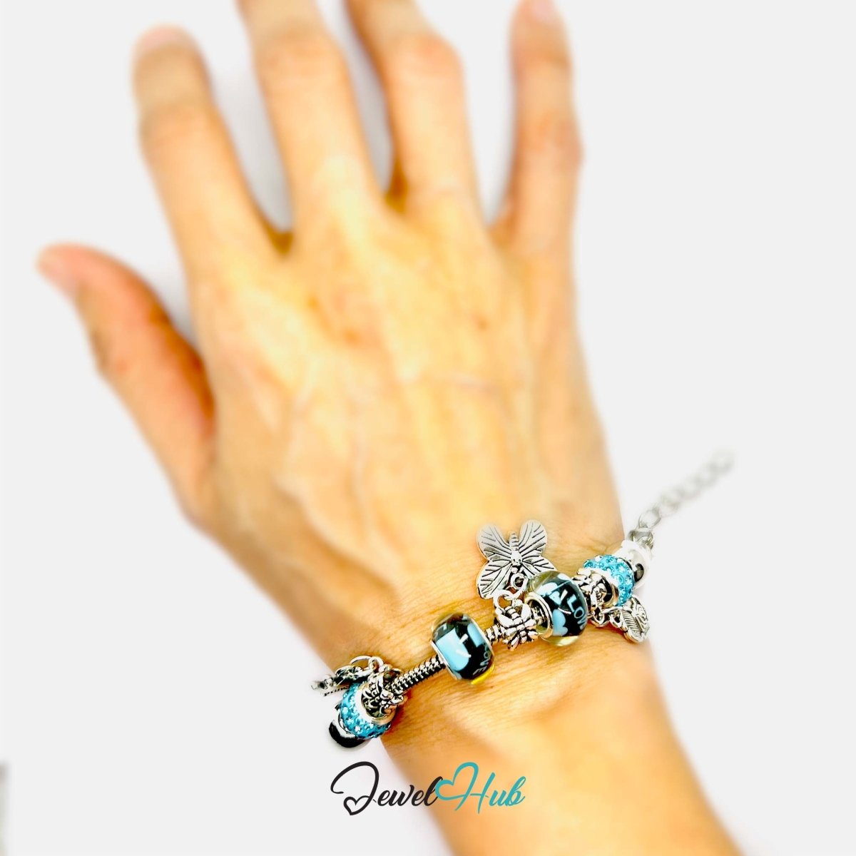 Zinc Alloy Cyan Duo Bead Butterfly Rose Crown Charm Bracelet 18 - 22cm - JewelHub.co.uk